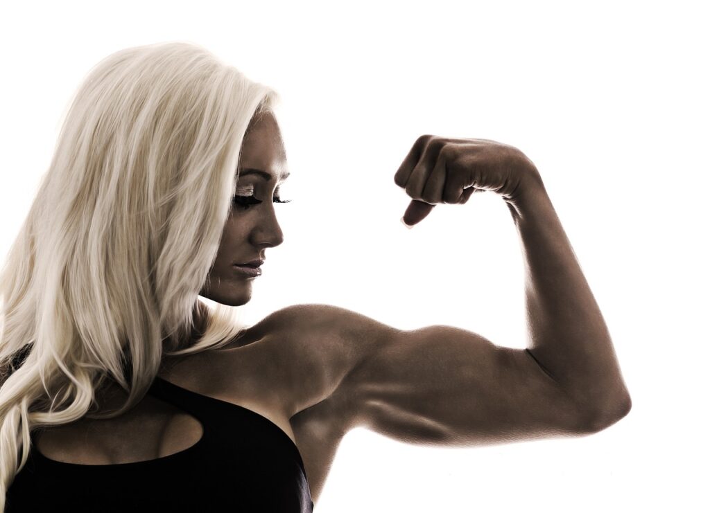 A woman showing off her biceps